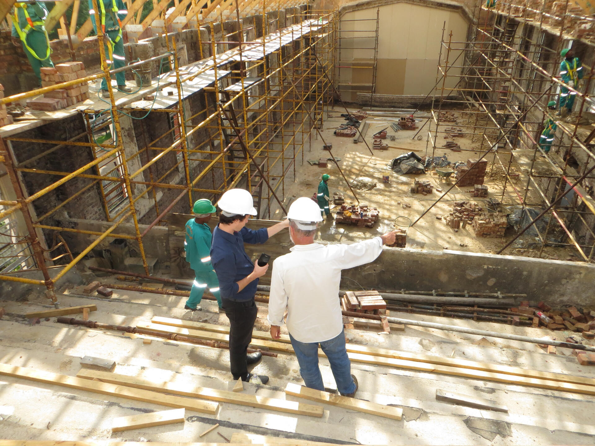 Construction sight with foreman reviewing work.